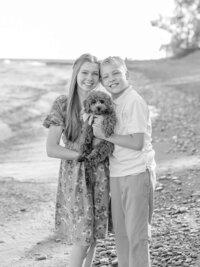 Kids holding a puppy by Lake Erie.
