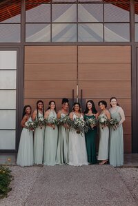 Bride and bridesmaids hold bouquets ad