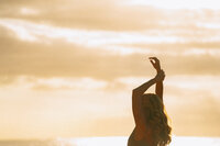 Nicole standing in a natural Kauai setting, representing her leadership and passion for holistic wellness at Love Light Wellness