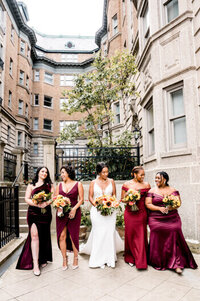 bride and bridesmaids walking together on cleveland wedding day