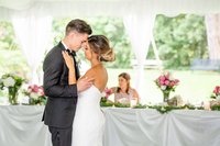 Newlyweds share their first dance during their outdoor summer wedding at Elsie Perrin Williams Estate