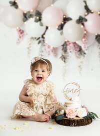 1st birthday photoshoot of baby girl eating her birthday cake. This was taken in Woodstock, right outside of the Atlanta area.
