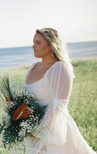 hawaiian bride holding bouquet