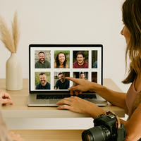 Minneapolis dating photographer reviewing image selections on a laptop with a client, representing the process of choosing the best photos for an online dating profile.