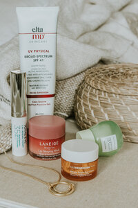 Brand photo of skincare products on a coffee table book