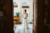 bride in the solarium of the private residence where she got ready the morning of her wedding