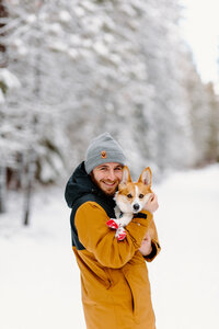husband-with-dog-in-snow