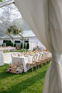 Julia and Cameron share a first look at Boxwood Estate surrounded by florals and a historic manor behind them.