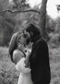 Embracing couple in nature captured by Southern California wedding photographer