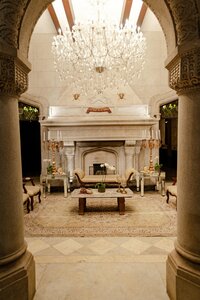 Elegant marble hotel lobby with chandeliers — symbolizing refined accommodations and world-class service.