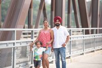 Family standing on a bridge in Saskatoon.