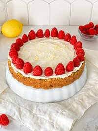 A lemon-raspberry cake with cream cheese frosting and fresh raspberries.