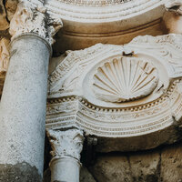 Ancient archway entrance showcasing classic European architecture.