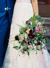 bride and groom with bouquet by flourish florals designs
