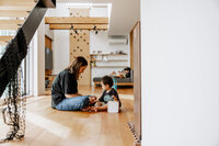 Mother and a little boy playing at home