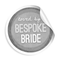 A circular sticker with a curled corner reads loved by BESPOKE BRIDE in white text on a gray background, capturing the unique touch of a Colorado Photographer.