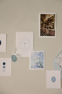 A wedding invitation flat lay on the wall
