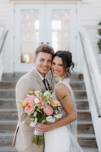 wedding shoot in the desert next to a cactus