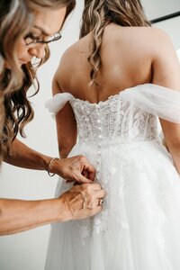 wedding photo of a bride getting ready taken by a minneota wedding photographer