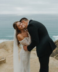 bride and groom on cliff