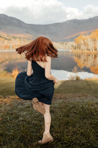 Natural light lifestyle family portraits with kids playing in nature.