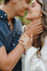 Couple embracing for engagement photos