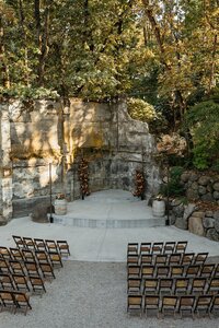Ceremony Setup with Wooden Chairs and Floral Backdrop - Megan & Amber | Hood River Wedding  - LGBTQ Wedding