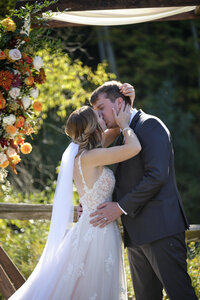Photo of bride and groom posing