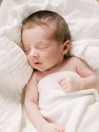 A baby sleeping during a Richmond newborn photography session by Katie Stansfield Photography.