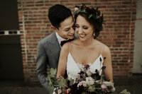 Bride and Groom laughing during toasts at Axis Pioneer Square by seattle wedding coordinator