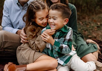 Siblings having fun during a family photo session