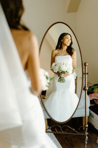 groom kissing bride from behind