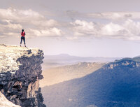 Canva - Female Hiker Standing on a Cliff