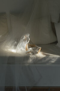 detail of brides shoes in artful light