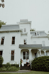 Bride and groom walking through the golden meadow at The Kester Homestead during golden hour — editorial wedding portraits in Central New York.