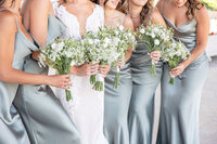 bridesmaids holding wedding flowers