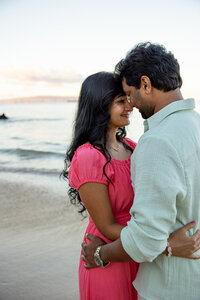 Hawaii Engagement Photographer captures couple touching foreheads during sunset beach engagement photos on Maui