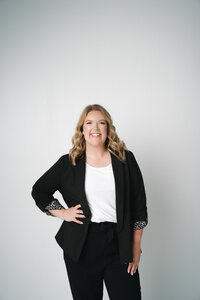 Morgan, lead wedding planner at Blush Events in Wichita, Kansas, smiling in professional portrait.