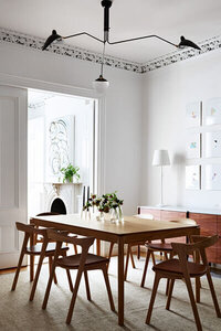 Classic brownstone interior design showcasing modern dining room furniture by Boston interior decorators, blending heritage with modern flair. 