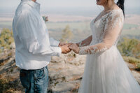 photo of bride and groom holding hands