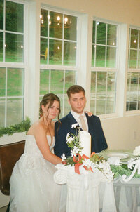 film photo of wedding couple crying during speeches at Blueberry Hill Estate in Paoli, Indiana