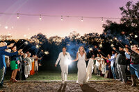 colorful sunset for a sparkler exit photographed by Jess rene photos at a destination wedding