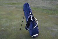 Water resistant golf bag cover by Over Armor Golf standing on golf course