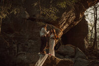 A bride and groom dance in vintage clothes for an alternative, intimate adventure elopement in the mountains of East Tennessee.