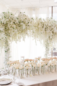 Wedding neon sign on greenery backdrop