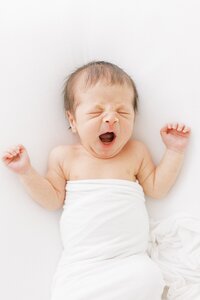yawning baby asleep for their dallas newborn  photography photos