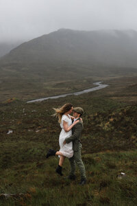 groom kissing brides forehead