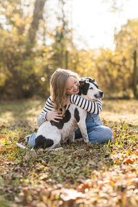 Claire Diana hugging her dog Ladybug