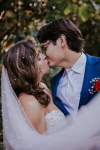Destination wedding photographer captures bride and groom kissing during destination wedding