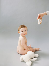 chunky 8 month old baby naked studio portrait shot by Seattle Newborn and Maternity Photographer Brittany Carvalho